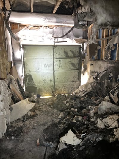 Fire- and soot-damaged garage before cleanup
