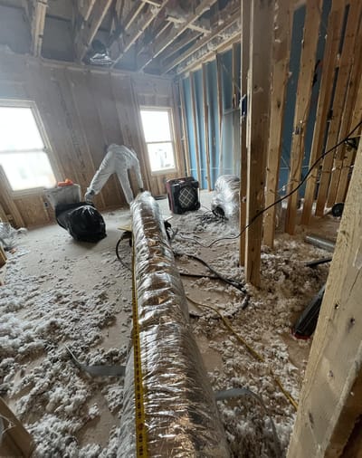 Room taken down to bare framing with the HVAC ducting removed
