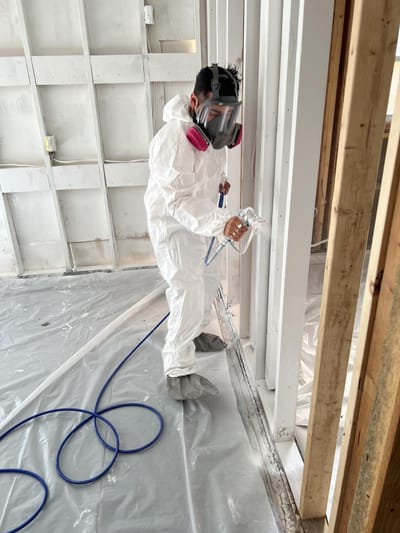 Applying an odor-locking encapsulant to the cleaned basement framing