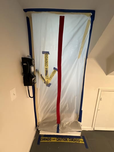 Containment sealing off the basement stairwell to stop the smoke from climbing