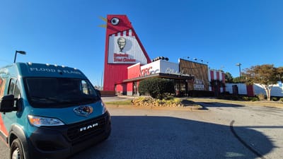 The front of the Flood & Flame van with the Big Chicken behind it