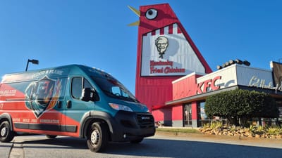 The Flood & Flame van parked in front of the Big Chicken in Marietta