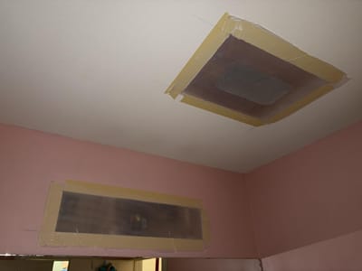 The vent openings sealed over with plastic after the moldy assemblies came out, before new covers and duct cleaning
