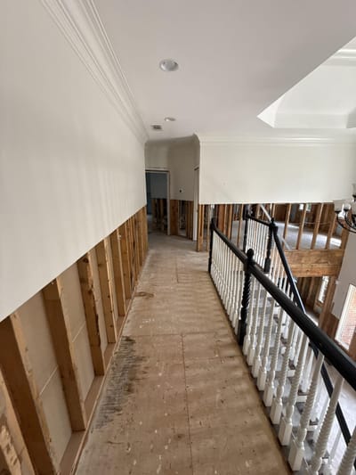 Approved four-foot flood cuts in the upstairs walls, exposing the framing for treatment