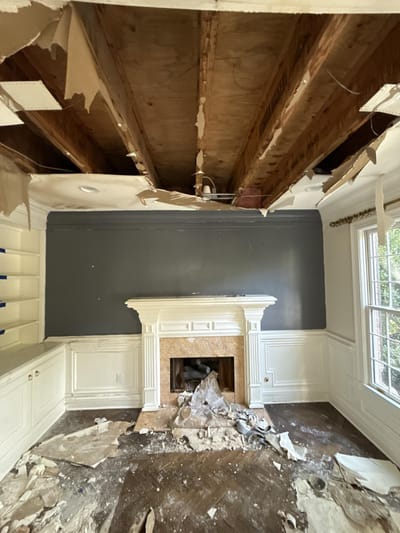 Collapsed ceiling in the study after days of water running through the home
